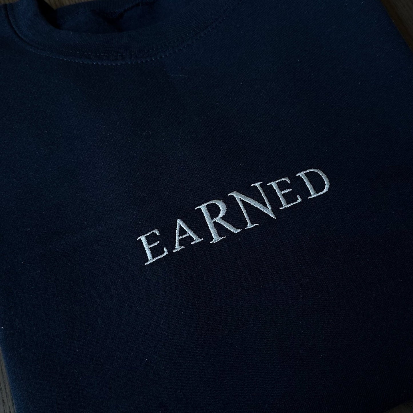 eaRNed Sweatshirt (Embroidered) - NurseStrong